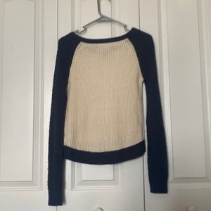 cream and blue sweater